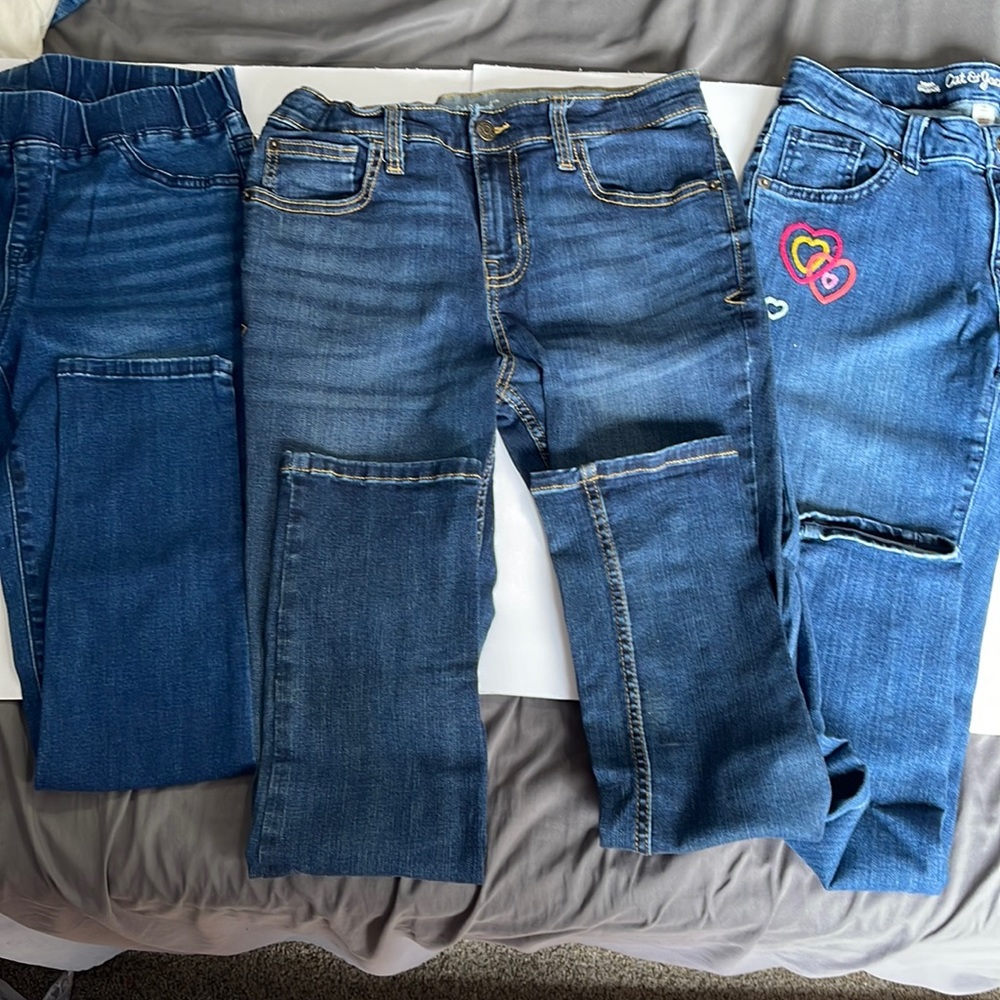 2 skinny 1 jegging. Sz 14 cat&jack. Blue jeans used.one has cute heart pattern.